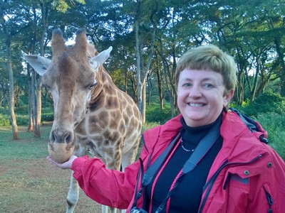 Maureen Feeding Giraffe